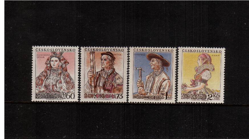 National Costumes - 1st Series<br/>
An unmounted mint set of four but with the top value being very, very lightly mounted.<br/>
Thus three unmounted and one mounted.<br/>SG Cat 50.00