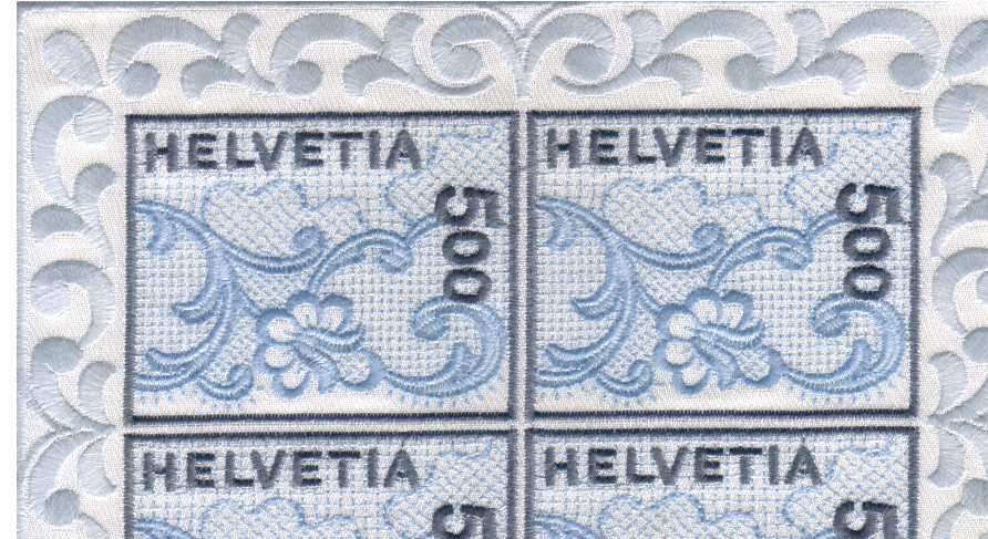 the famous St Gallen embroidery self adhesive Miniature sheet featuring four single stamps and a fancy silk border around the four.  Very scarce!